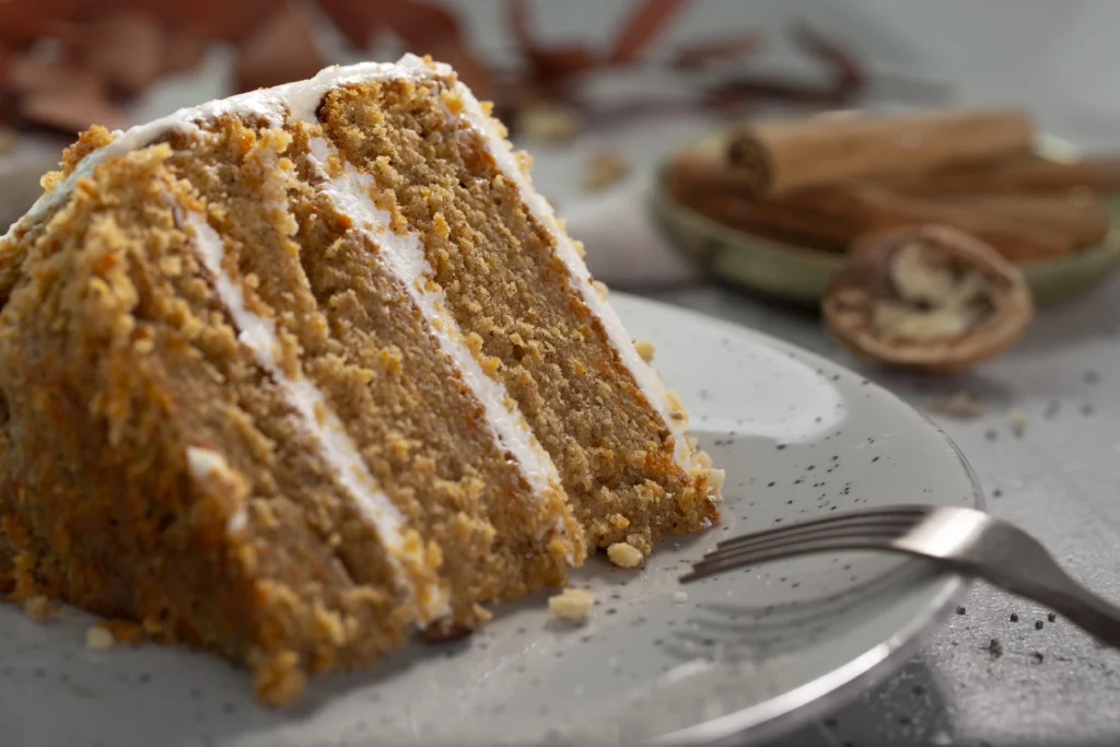 A delicious slice of homemade applesauce cake recipe, showcasing its moist crumb and spiced flavour, perfect for a comforting treat.