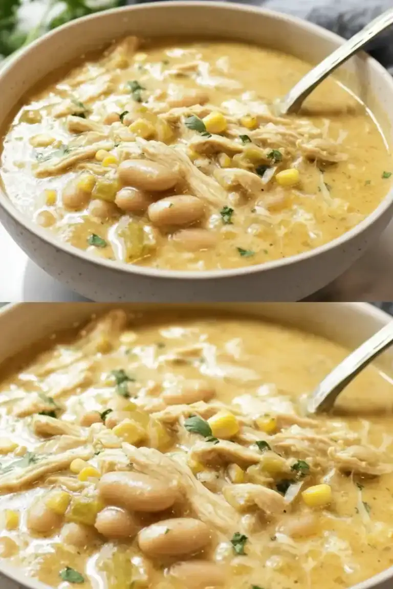 Creamy chicken and bean soup with corn and herbs in a white bowl, perfect for cozy meals. Made with tender chicken, white beans, corn, and fresh herbs in a flavorful broth.